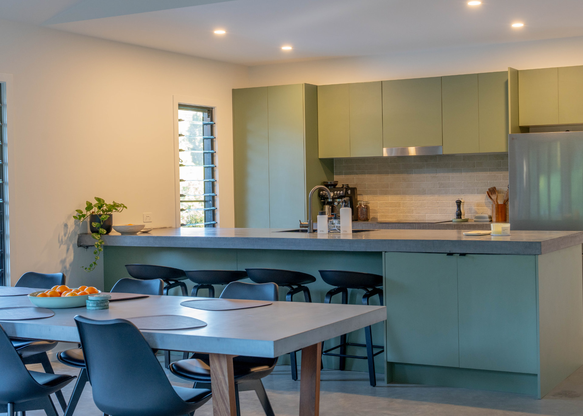 Sage joinery and concrete benchtops