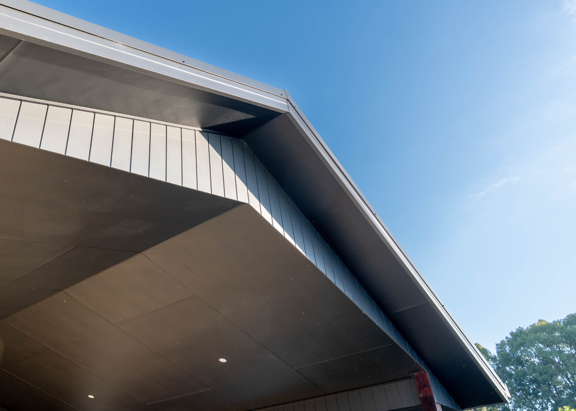 Roof apex and cladding junction